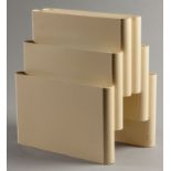 A GIOTTO STOPPINO KARTELL MAGAZINE RACK, 1970, in ivory colour with a circular handle and six
