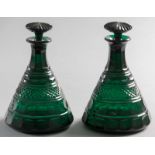 A PAIR OF 19th CENTURY MOULDED GREEN GLASS SHIP'S DECANTERS, with mushroom stoppers, faceted necks