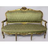 A FRENCH-STYLE GILTWOOD SOFA, the back-rail with pierced floral carving above an upholstered back