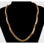 A 9ct YELLOW GOLD TUBE-LINK NECKLACE, composed of twelve links, tongue and groove and safety