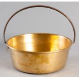AN EARLY 20th CENTURY CAPE BRASS PRESERVE PAN, the circular body with angled sides and a forged iron