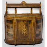 AN EDWARDIAN WALNUT CREDENZA, the bow-fronted top surmounted by mirrors and a gallery rail, the