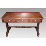 A WILLIAM IV MAHOGANY WRITING TABLE, the moulded top above three short drawers with lion mask