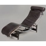 A LE CORBUSIER-STYLE RECLINER, the black leather upholstery mounted on typical chrome tubing resting