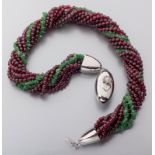 A STERLING SILVER, GARNET AND JADE TEN-STRAND NECKLACE, comprising of eight strands of garnets and