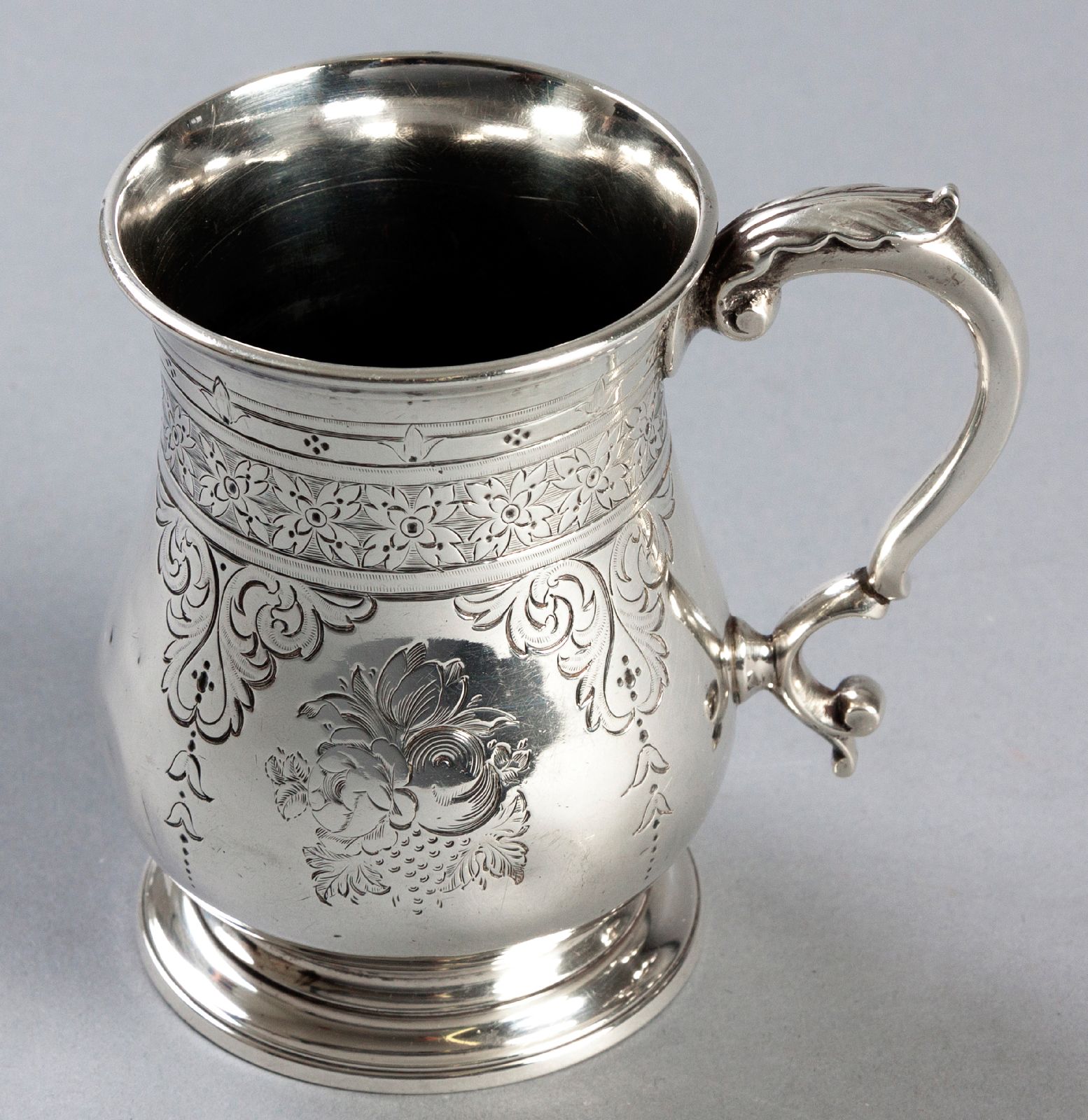 A VICTORIAN SILVER CHRISTENING MUG, LONDON 1862, G.R.E.B., fold-over rim, applied C-scroll handle,