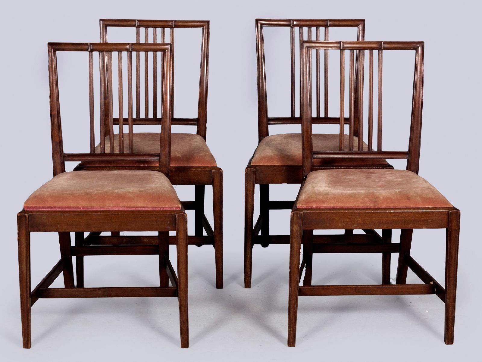 A SET OF FOUR GEORGE III MAHOGANY DINING CHAIRS, the channelled backs with lozenges and reeded