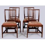 A SET OF FOUR GEORGE III MAHOGANY DINING CHAIRS, the channelled backs with lozenges and reeded