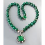 A SILVER AND NATURAL GREEN SAPPHIRE NECKLACE, composed of forty-one faceted sapphire beads, with a