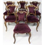 A SET OF SIX 19th CENTURY CONTINENTAL ROSEWOOD DINING CHAIRS, the top-rails with floral carving
