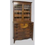 A MARRIED GEORGE III MAHOGANY CHEST-BOOKCASE, the upper section with a moulded pediment above