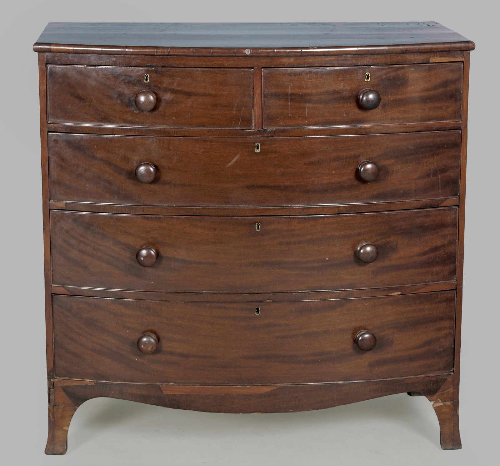 A GEORGE III MAHOGANY BOW-FRONTED CHEST OF DRAWERS, the well-figured top above two short and three