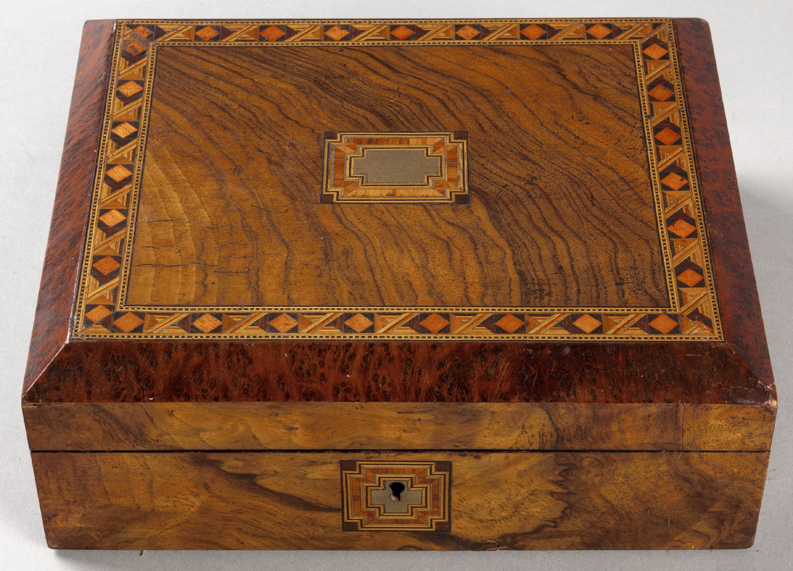 A VICTORIAN TUNBRIDGEWARE TRAVELLING COMPANION, in various exotic woods including birds eye maple,