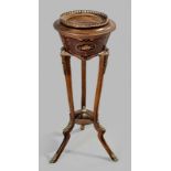 A FRENCH REGENCY-STYLE TORCHIERE JARDINIERE, the removable top with a brass gallery rail above a