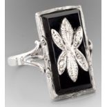 AN 18ct WHITE GOLD, BLACK ONYX AND DIAMOND RING, of Art Deco style, the rectangular onyx plaque