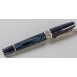 A MONTEGRAPPA EXTRA OTTO FOUNTAIN PEN, the blue marbled body with an 18ct gold nib and rotating