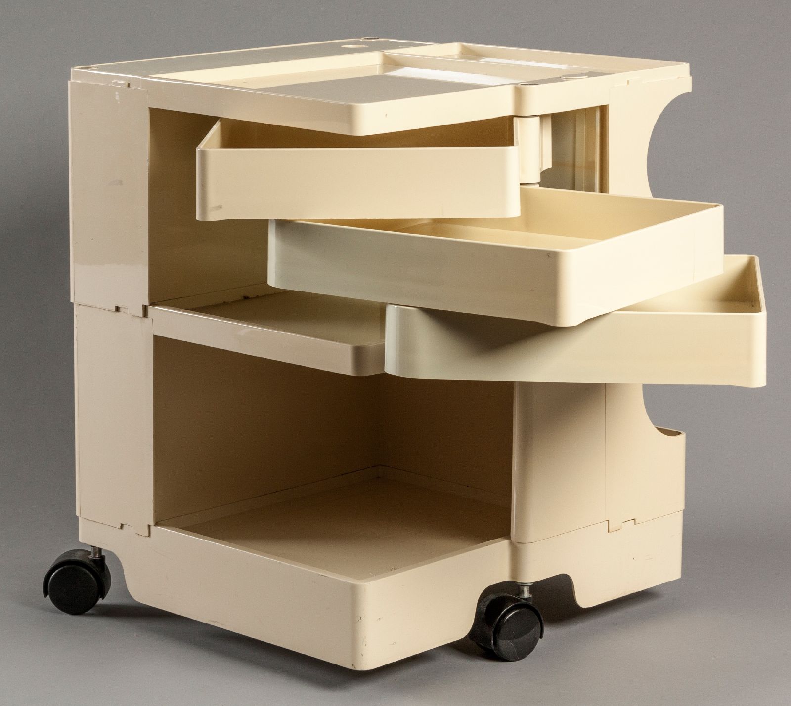 A BIEFFEPLAST BOBY TROLLEY BY JOE COLOMBO, 1970, in ivory colour, the square form housing various