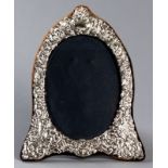 A 20th CENTURY SILVER PHOTOGRAPH FRAME, LONDON 1970, K.F. LTD., the frame profusely embossed with