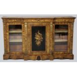 A VICTORIAN WALNUT BREAK-FRONT CREDENZA, the highly figured top above a marquetry inlaid frieze