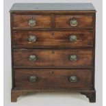 A GEORGE III MAHOGANY CHEST OF DRAWERS, the moulded top above two short and three long graduated
