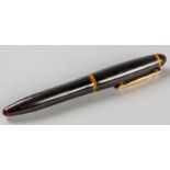 A PLATINUM PRESIDENT FOUNTAIN PEN, the black ceramic style body with an 18ct gold nib and piston