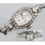 A 14ct WHITE GOLD LADIES DRESS WATCH BY HAMILTON, U.S.A., with rectangular enamel dial, face