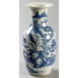 A 19th CENTURY CHINESE BALUSTER VASE, decorated in under-glaze blue with a lake scene of pagodas,