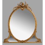 AN ANTIQUE OVAL GILT MIRROR, mounted in a foliate frame, the crest surmounted by a putti and