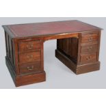 AN EARLY 20th CENTURY PEDESTAL DESK, the rectangular top set with a gilt tooled leather writing