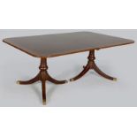 A RECTANGULAR MAHOGANY DINING TABLE, comprising two D-ends and two extension leaves, standing on