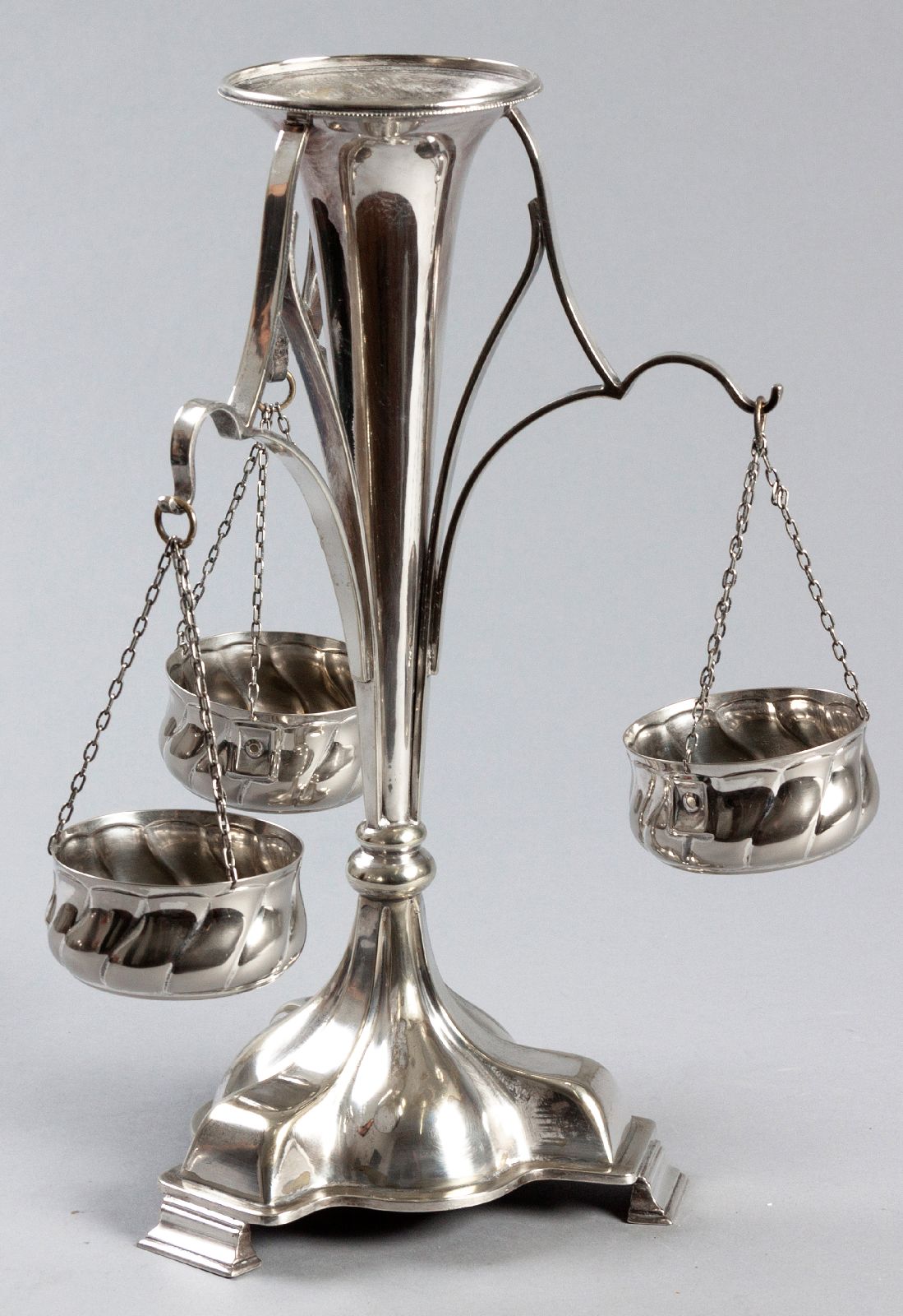 A SILVERPLATE EPERGNE, the central trumpet-form vase, standing on a bulbous tri-pod vase, the vase