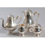A FOUR PIECE CHRISTOFLE SILVERPLATE TEA AND COFFEE SERVICE, composed of a coffee pot, teapot,