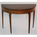 A GEORGE III MAHOGANY TEA TABLE, the demi-lune top with plain surface below, a beaded strung