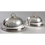 A PAIR OF GRADUATED SILVERPLATED MEAT DOMES BY WALKER & HALL, with removable rope from handles,
