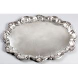 A WILLIAM IV SILVER TRAY, SHEFFIELD 1836, T.J. & N. CRESWICK, of oval serpentine form, the border