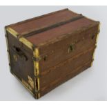 A LATE 19th CENTURY TRAVELLING CHEST, covered in painted canvas with oak batons and brass strapping,