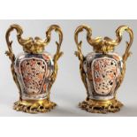 A FINE PAIR OF JAPANESE IMARI VASES, FROM THE GENROKU PERIOD, CIRCA 1860, the bodies pierces and