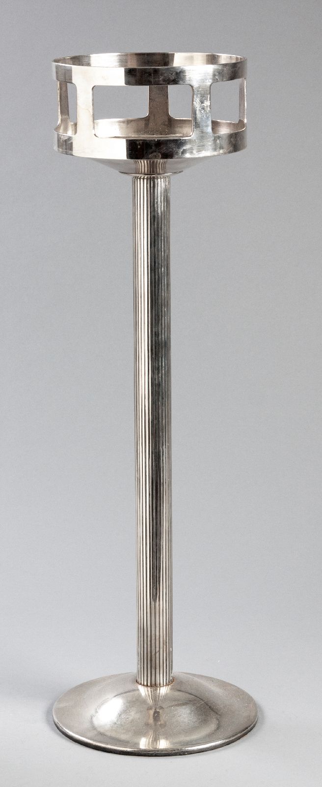 AN ART DECO CHRISTOFLE SILVERPLATE WINE COOLER STAND, circular top on a reeded stem, top engraved