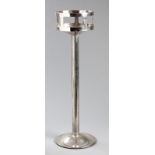 AN ART DECO CHRISTOFLE SILVERPLATE WINE COOLER STAND, circular top on a reeded stem, top engraved