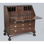 AN 18th CENTURY CONTINENTAL MAHOGANY FALL-FRONT BUREAU, the fall opening on lopers to reveal a