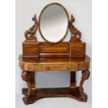 A VICTORIAN MAHOGANY DRESSING TABLE, the upper section with an oval mirror flanked by two pillars