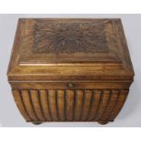 AN EARLY VICTORIAN ROSEWOOD CELLARET, the rectangular caddy-top with a floral carved panel above a