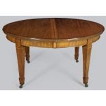 AN EDWARDIAN MAHOGANY DINING TABLE, the oval top above a beaded frieze standing on inlaid square