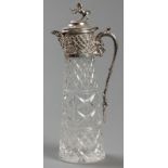A CONTINENTAL SILVER AND CUT-GLASS CLARET JUG, hinged top with a lion holding a shield form