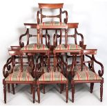 A SET OF NINE VICTORIAN-STYLE MAHOGANY ELBOW STYLE DINING CHAIRS, the dished top-rails above