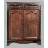 A 19TH CENTURY CAPE STINKWOOD AND MAHOGANY JONKMANSKAS, the moulded top above two short drawers with