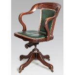 AN ANTIQUE MAHOGANY CAPTAIN'S CHAIR, the leather upholstered back-rest and seat with close-button