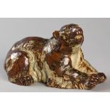 A ROYAL COPENHAGEN FIGURE OF A RECUMBENT GRIZZLY BEAR, realistically moulded, base signed and
