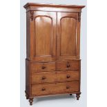 A VICTORIAN MAHOGANY LINEN PRESS, the upper-section with a plain pediment above two arched