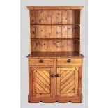 A LATE 19TH CENTURY CAPE PINE KITCHEN DRESSER, the upper-section with a moulded pediment and two